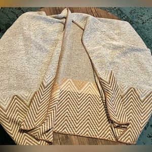 Cozy shawl with fun design along the bottom